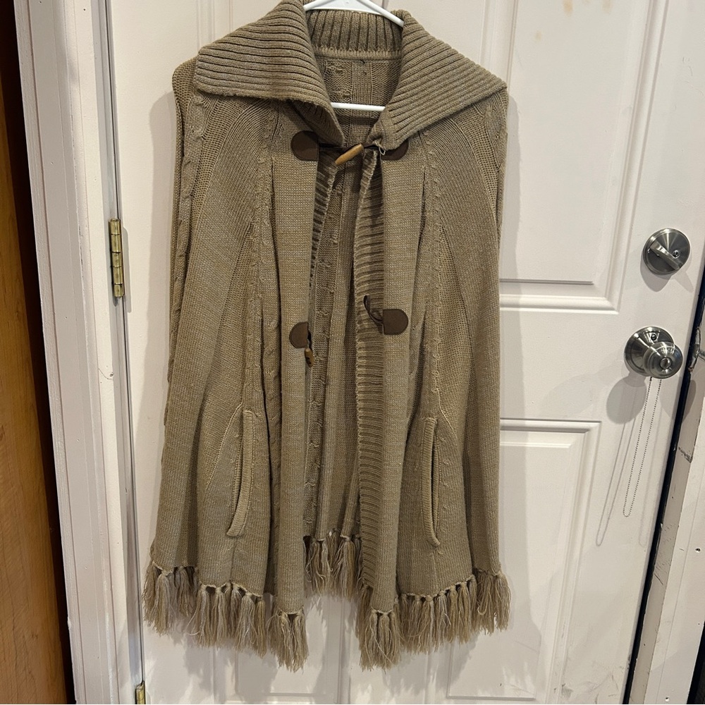 Elegant Beige Knit Cape with Fringe